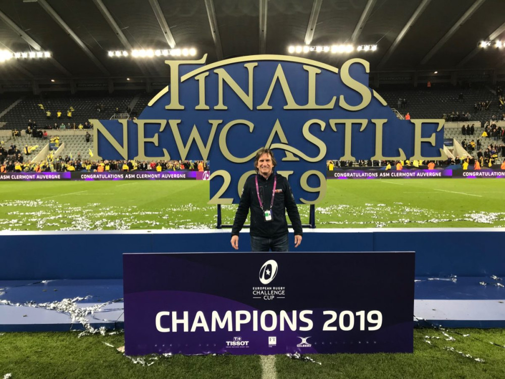 Ash-on-field-with-Champions-2019-sign-1200x900.jpg